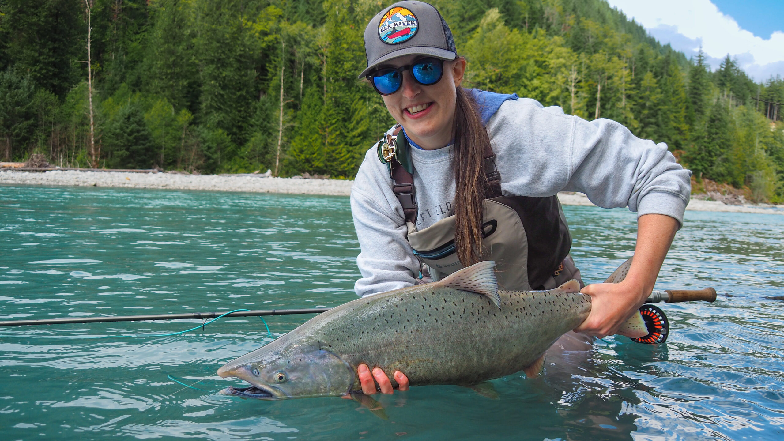The Pacific Salmon Slam: Amanda Fitch with a Chinook Salmon caught on a spey rod.