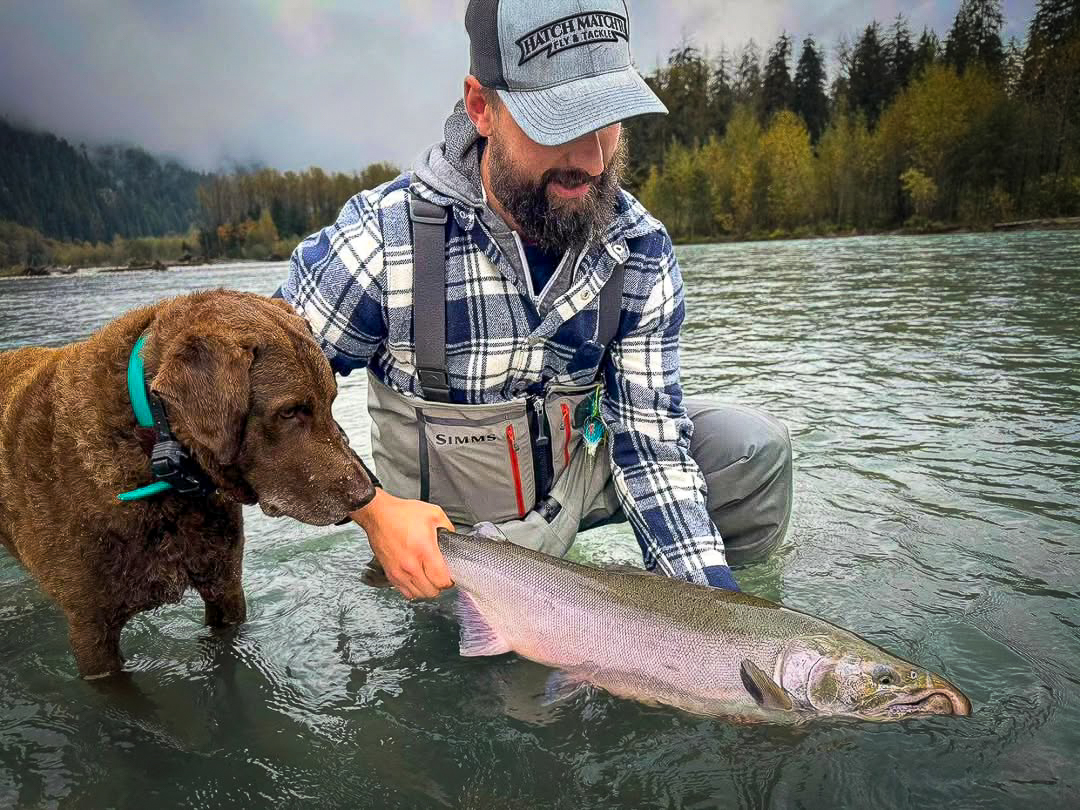 Evan and Floyd Holmgren displaying a coho.